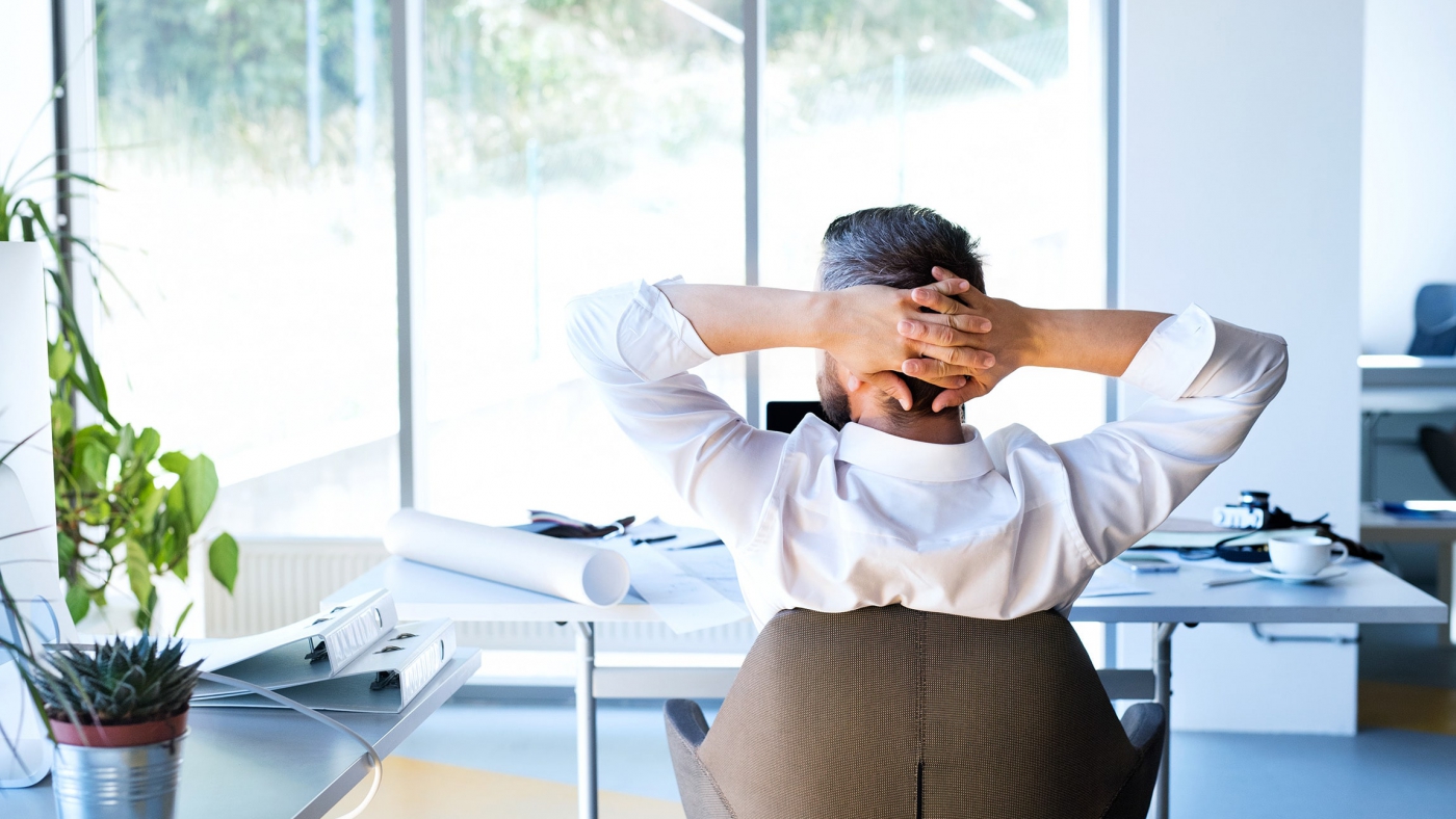 Businessman-at-the-desk-in-his-office-resting.ee44-min