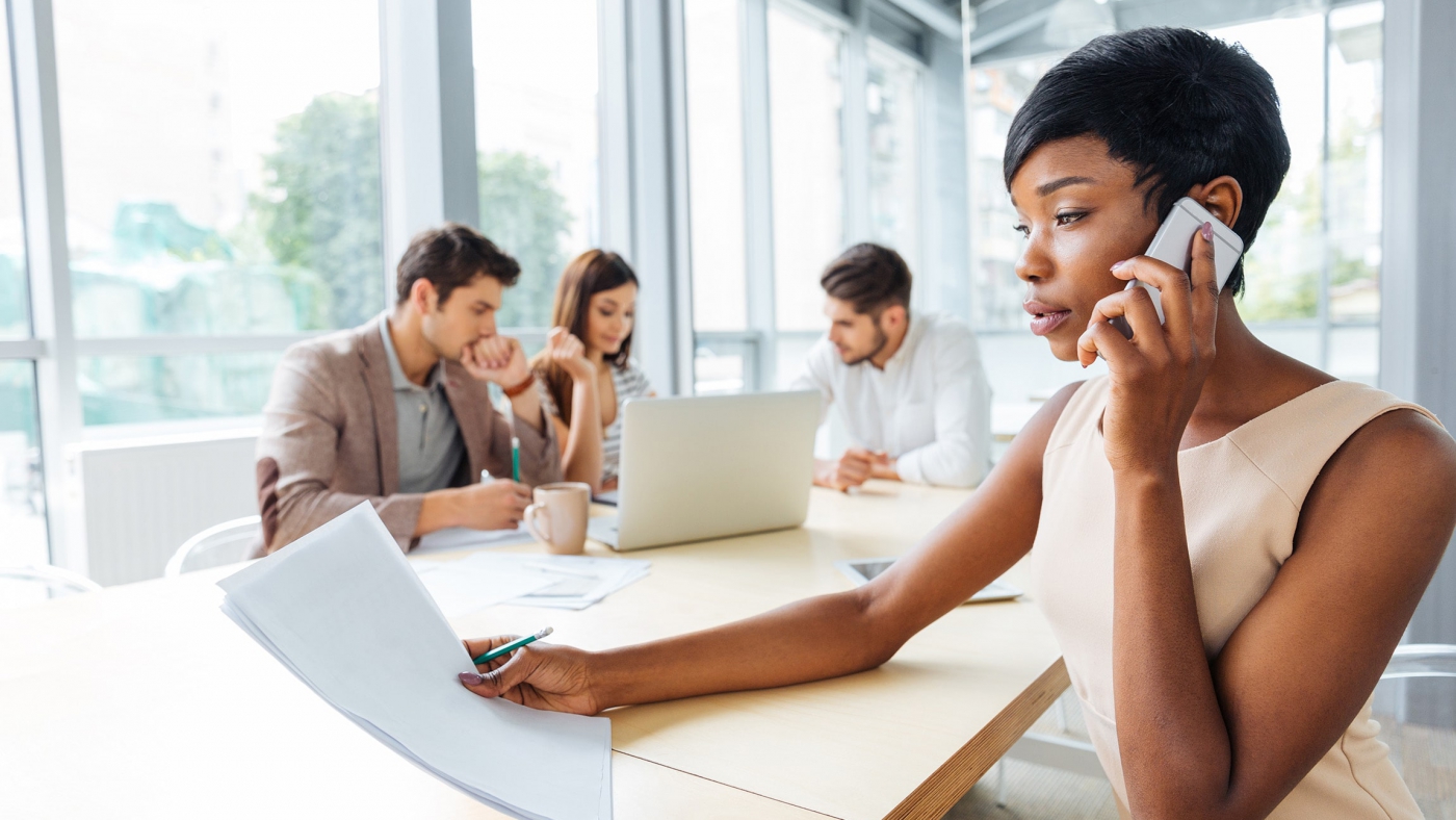 serious-businesswoman-with-documents-talking-on-P9Q6LX6t5t33-min